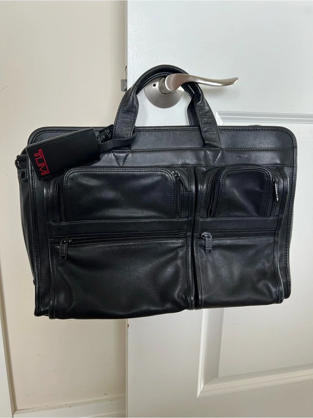 Tumi Black Leather Briefcase with Dual Front Zip Pockets